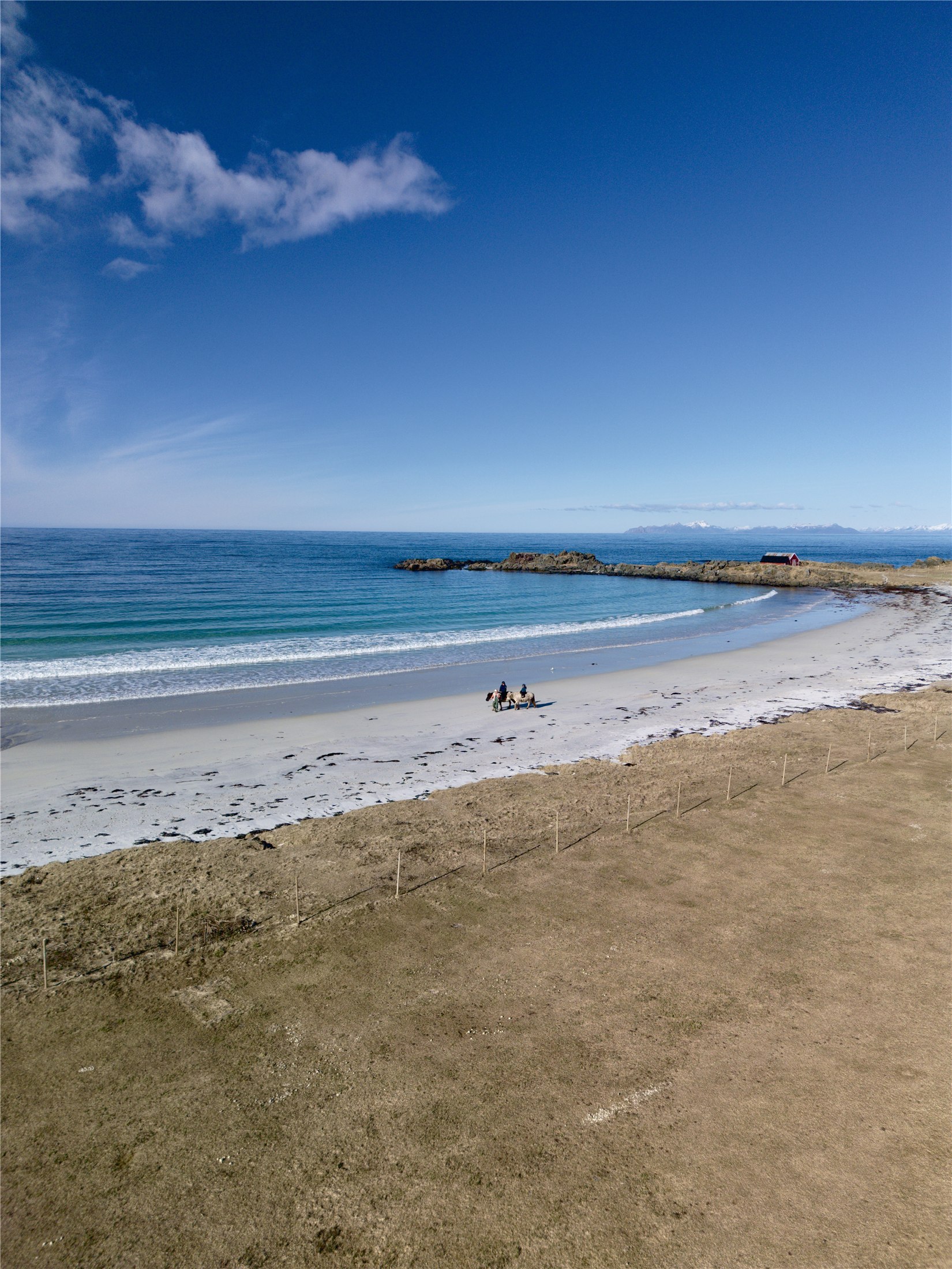 Horseback riders on the beach at Hov Gård