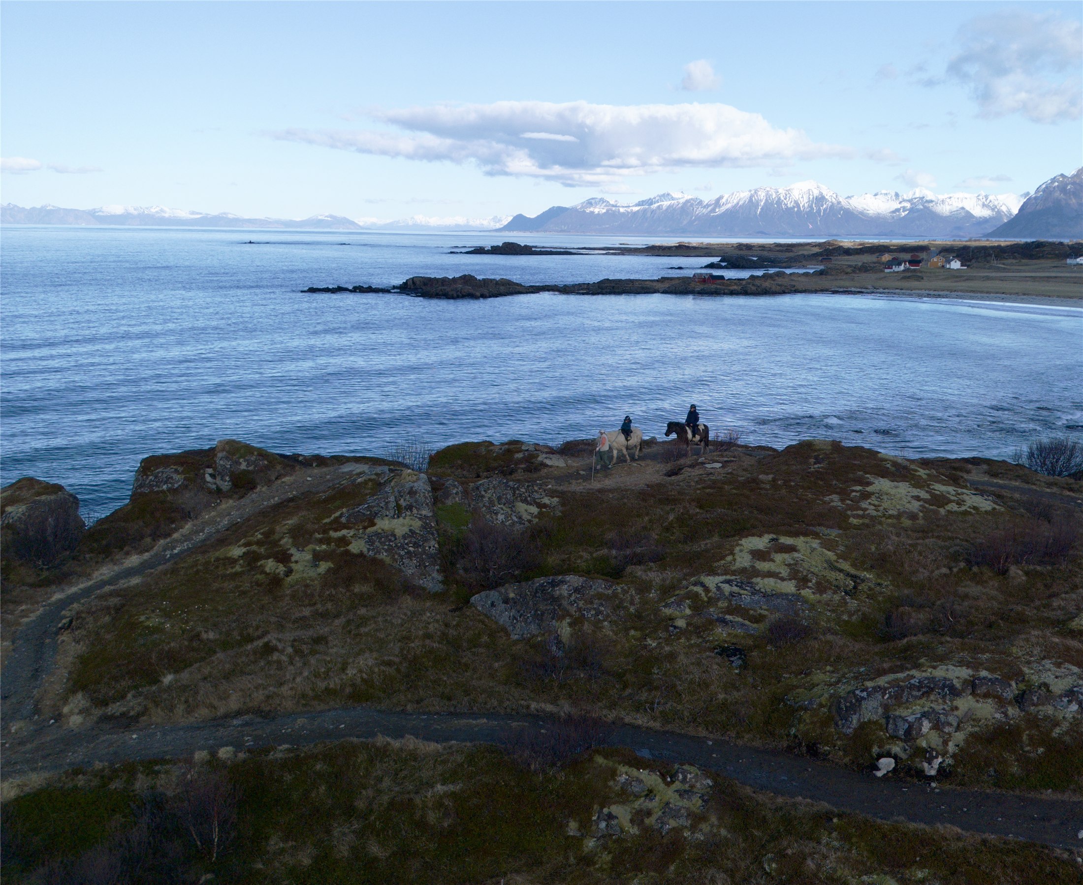 Horseback riders on the coast at Hov Gård