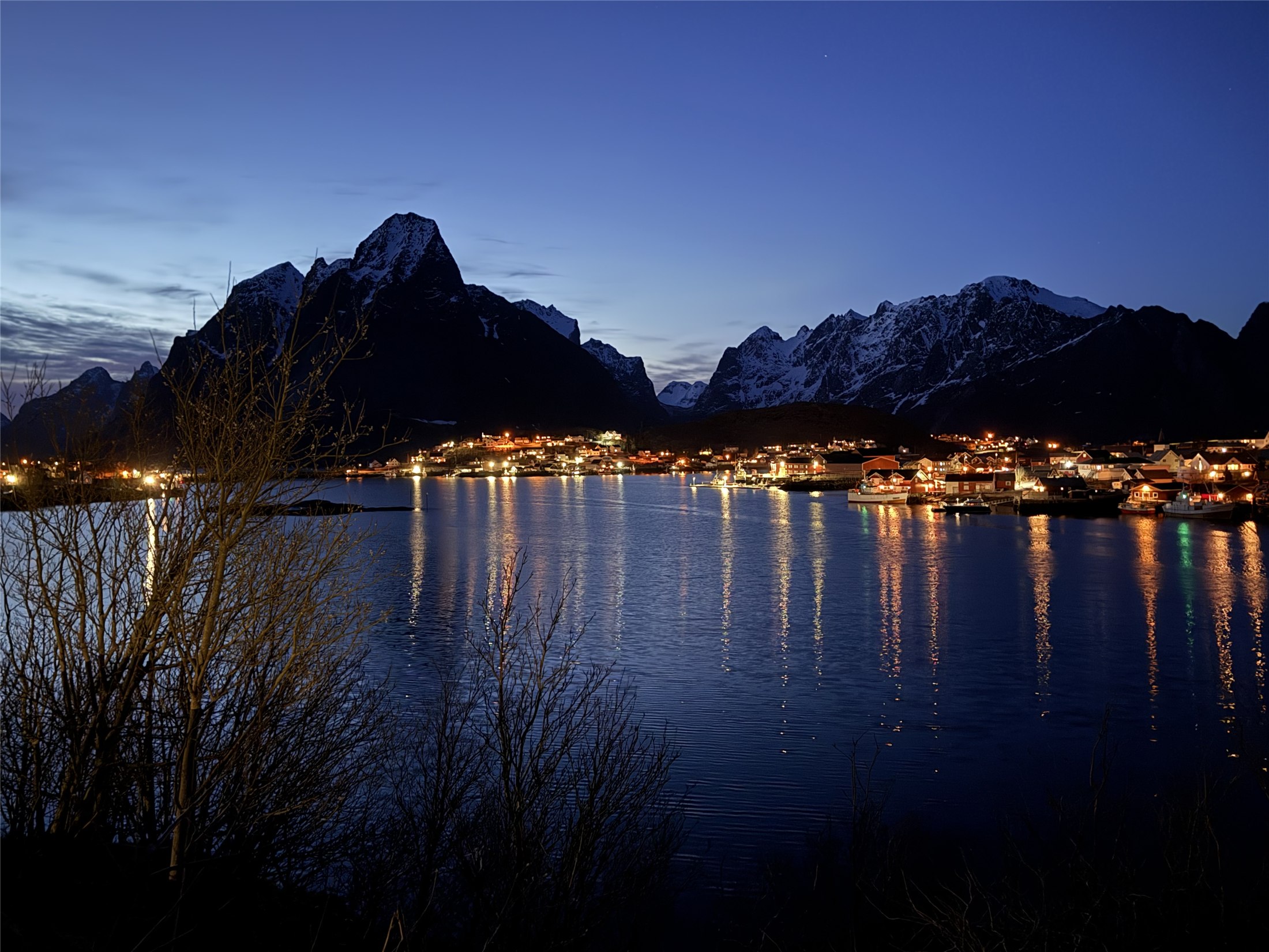 Reine lights reflected on the water at night