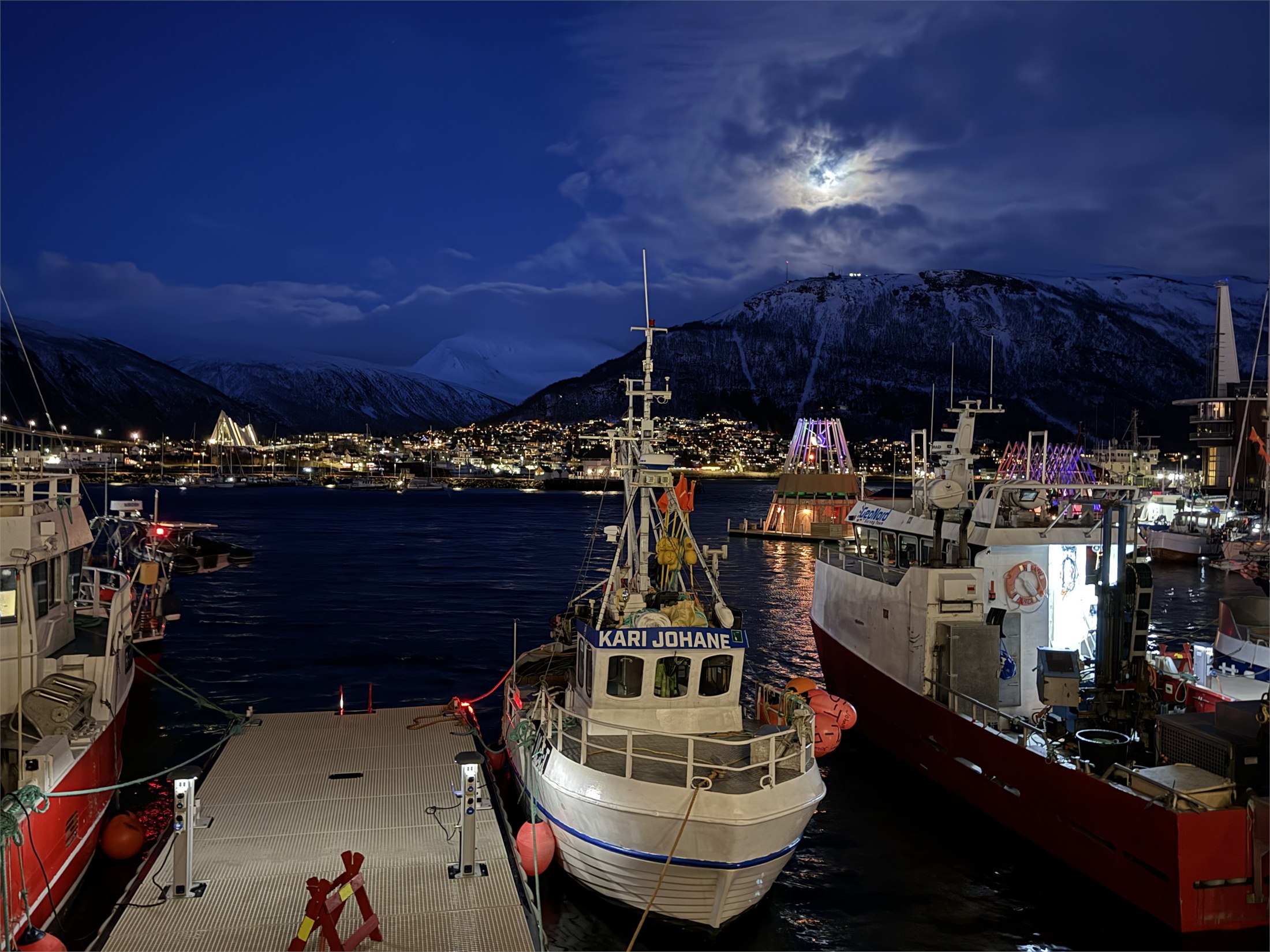 Moon over Tromsø harbor